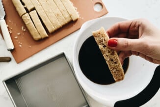 A slice of cake has been quickly submerged in a coffee mixture.